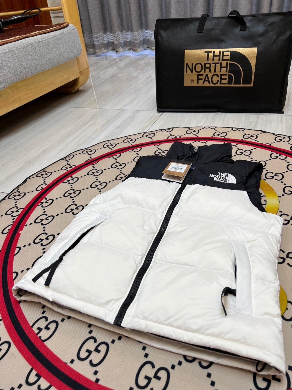 The North Face Puffer Vest in White and Black with Stand Collar